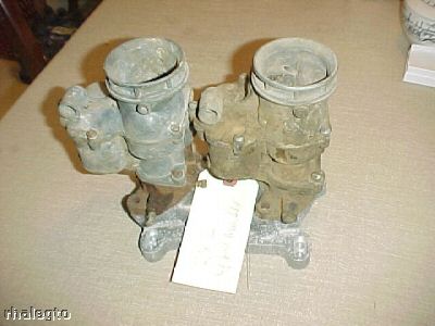 1972 Ford Ranchero - A pair of carburetors, possibly for a vintage vehicle, are shown with a tag for identification.