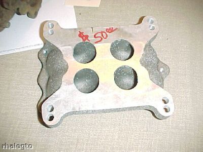 1972 Ford Ranchero - Carburetor spacer with four circular openings and handwritten price tag.
