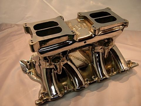 1972 Ford Ranchero - A shiny chrome intake manifold designed for dual carburetors is shown.