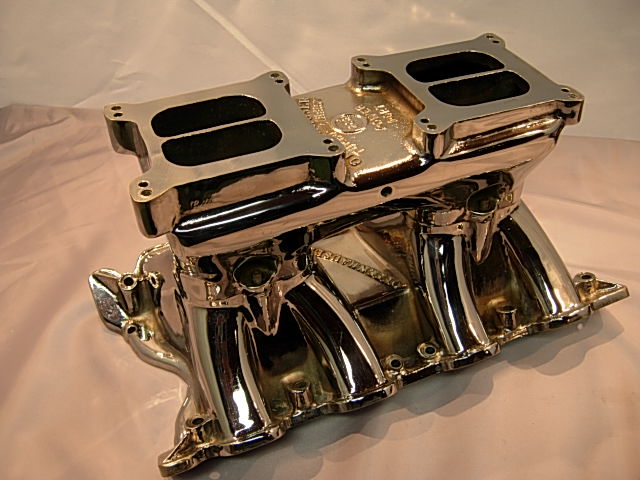 Chrome intake manifold with dual carburetors