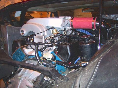 1972 Ford Ranchero - Custom engine modifications are visible in this engine bay, an aftermarket intake system and a red air filter.