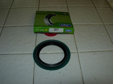 1990 Ford Bronco - An SKF oil seal is shown next to its packaging, which displays the part number 24917.