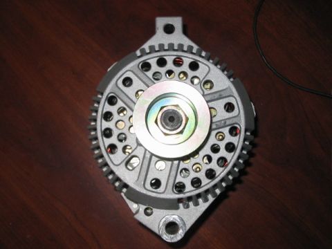 1991 Ford Bronco - Close-up of an automotive alternator, likely a replacement part.