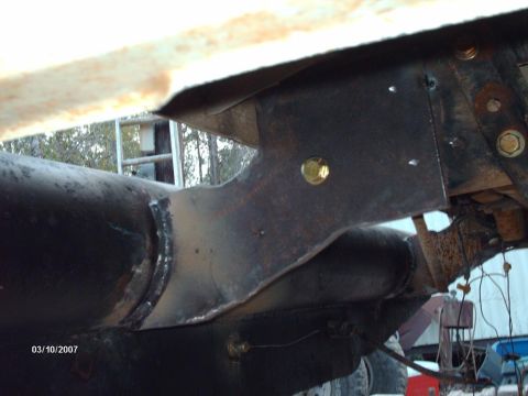1990 Ford F-150 - Welded bracket and pipe assembly, possibly part of a suspension modification.
