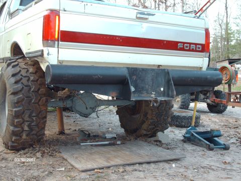1990 Ford F-150 - This Ford truck appears to be undergoing modifications, with its rear axle and suspension clearly visible.