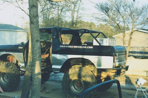 1978 Ford Bronco - Modified 1978 Ford Bronco with a prominent roll cage and oversized off-road tires.