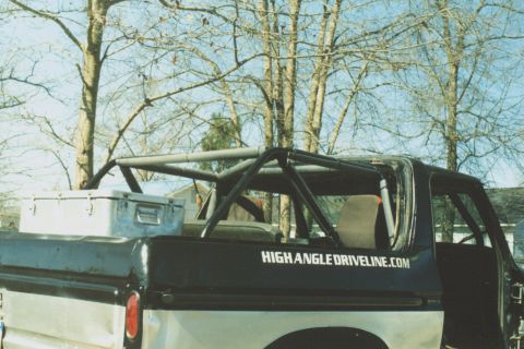 1978 Ford Bronco - A custom roll cage is installed in the bed of a pickup truck, obscuring the vehicle's model year.