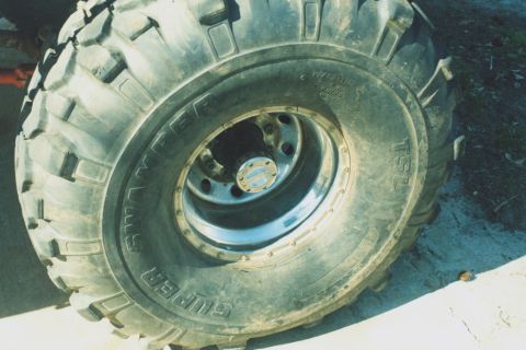 1978 Ford Bronco - Close-up of a large off-road tire and wheel assembly.