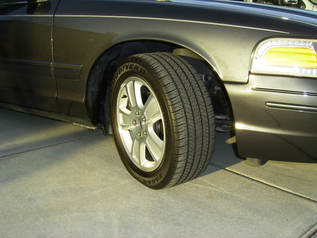 Close-up of an aftermarket alloy wheel and tire on a sedan
