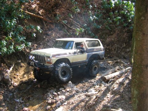 1992 Ford Mustang - This lifted 1978 Ford Bronco navigates a challenging, rocky, and muddy off-road course.