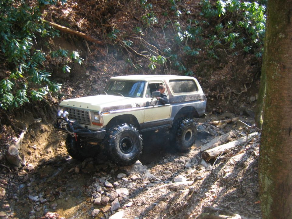 1978 Ford Bronco off-roading on a muddy trail