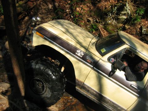 1992 Ford Mustang - A driver navigates a off-road trail in a vintage pickup truck.