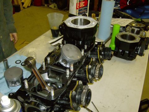 1982 Chevrolet C/K Pickup - Disassembled engine components laid out on a table, likely for repair or maintenance.