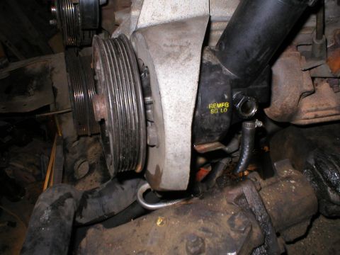 1978 Ford Bronco - Engine power steering pump and associated pulleys are shown in this close-up view.