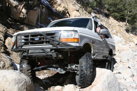 1996 Ford Bronco - This 1996 Ford Bronco navigates a challenging rocky trail, its off-road capabilities.