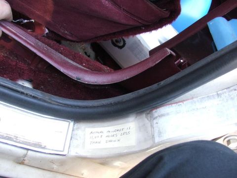 1991 Ford Crown Victoria LTD - A handwritten note on the interior door sill indicates the actual mileage is 11,078 miles less than what is displayed on the odometer.