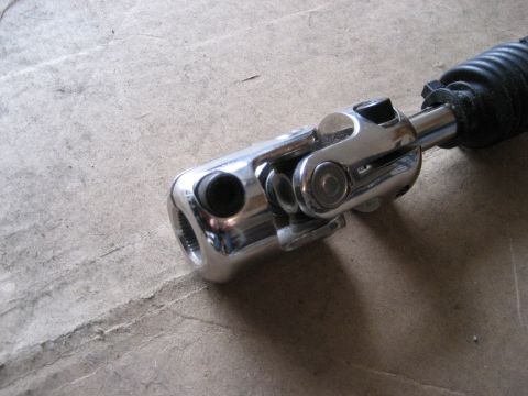 1979 Ford Bronco - Close-up of a chrome steering shaft universal joint, likely a replacement part.