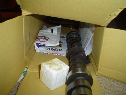 1976 Ford F-100 - Camshaft and foam block are inside a cardboard box with packaging materials.