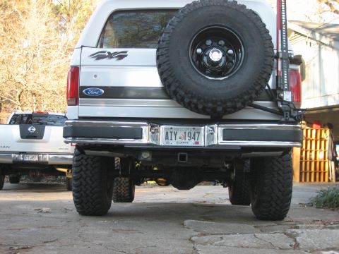 1996 Ford Bronco - I got the exhaust for christmas, and decided to try mounting the hi-lift on the carrier. the weight of it rests on the bumper so hopefully…
