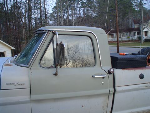 1967 Ford F-250 - Side view of a 1967 Ford F-250 pickup truck, its door and a toolbox.