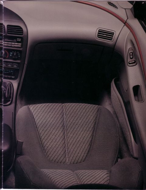 1993 Ford Probe - Interior view of a 1993 Ford Probe, highlighting the striped seat fabric and dashboard details.