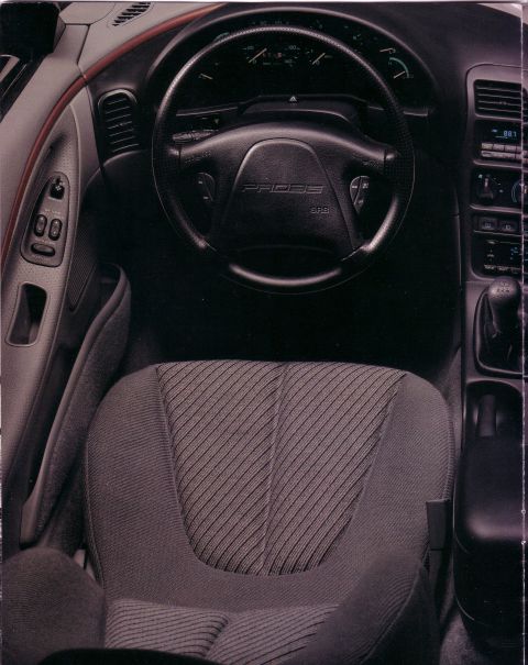 1993 Ford Probe - Interior view of a 1993 Ford Probe, highlighting the dashboard and driver's seat.