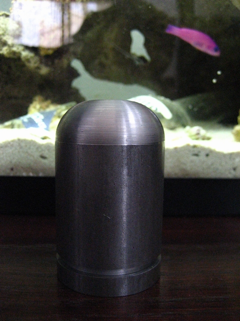1989 Ford Bronco - A metal component is positioned in front of a fish tank, obscuring any view of a vehicle.
