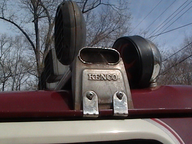 Close-up of Kenco snorkel and two off-road lights mounted on a vehicle's roof