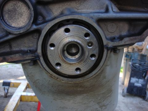 1983 Ford Bronco - the next thing was the main seal. i put a screw driver on the edge of the seal and it came right out. i cleaned the grease off the pilot ho…