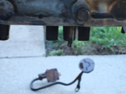 1983 Ford Bronco - i got the pump out with out much fuss as well. just below the motormount bolt you can see the oil pump drive.