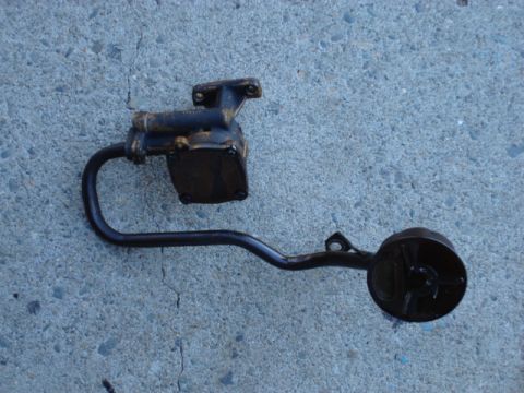 1983 Ford Bronco - here is the old pump out of its home. i just need to remove the pickup tube and clean it up and install on the new pump.