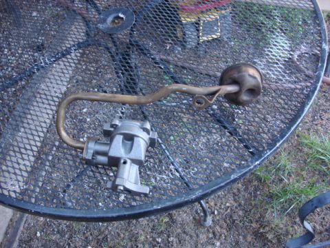 1983 Ford Bronco - after a good cleaning and the new gasket the pickup tube gets bolted to the new pump.