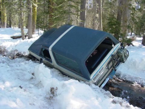 1986 Ford Bronco - This 1986 Ford Bronco is stuck in deep snow in a wooded area.