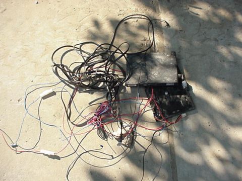 1992 Ford Bronco - found this under the drivers seat. i yanked it out, who knows what it was. looks aftermarket.