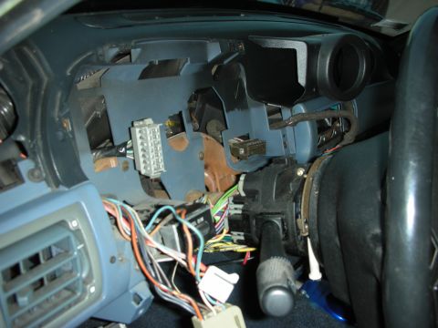 1990 Ford Mustang - The interior of a 1990 Ford Mustang shows exposed dashboard wiring and electrical components.