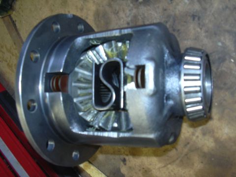 1996 Ford Crown Victoria - Close-up of an open differential carrier showing the spider gears and ring gear teeth.