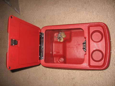 1990 Ford Bronco - Center console storage compartment with cup holders and keys.