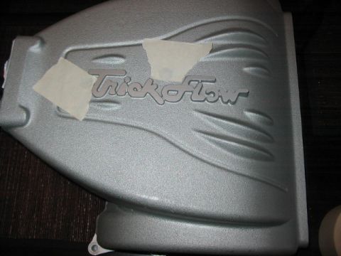 1991 Ford Bronco - A silver intake manifold with the "Trick Flow" logo visible, partially covered by tape.