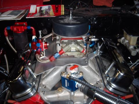 1984 Ford Bronco - Close-up view of a modified V8 engine, showing the carburetor and intake manifold.