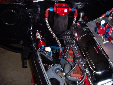 1984 Ford Bronco - Close-up view of an engine bay, highlighting custom fuel system components and polished valve covers.