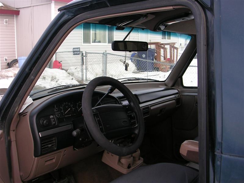Interior of a Ford truck showing dashboard and steering wheel