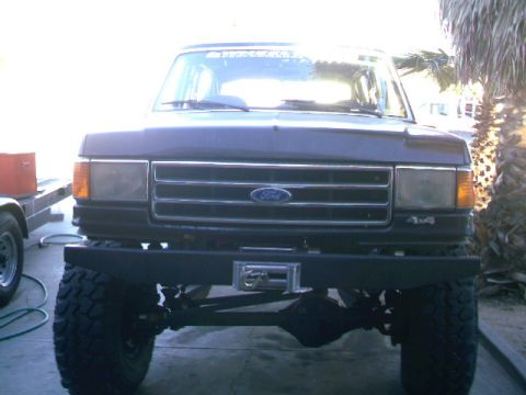 1989 Ford Bronco - Front view of a 1989 Ford Bronco, a custom bumper and winch.
