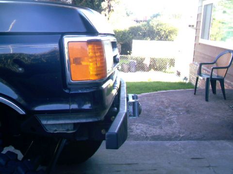 1989 Ford Bronco - Close-up of the front bumper and headlight assembly on a 1989 Ford Bronco.