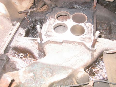 1973 Ford F-100 - This is a close-up view of an engine's intake manifold, showing the ports for cylinder heads.