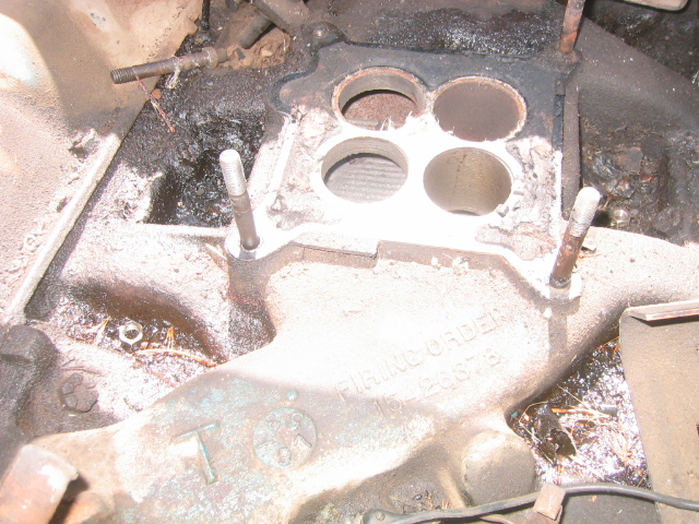 Close-up of an engine intake manifold with four circular openings. Text reads 'FIRING ORDER' and '126875'