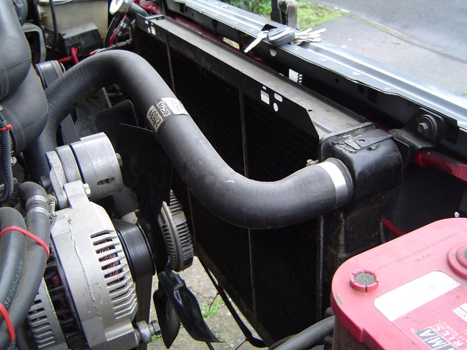 radiator, fan, alternator, and hoses in engine bay