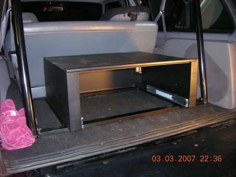 1996 Ford Bronco - A custom cargo box with a slide-out drawer is installed in the rear of a vehicle.