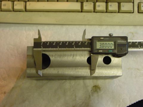 1994 Ford Bronco - A digital caliper is used to measure a metal component, showing a reading of 3.0000.