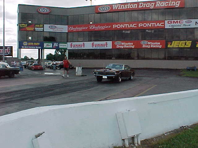 Factory Stock Muscle Car Drags, Milan Dragway September 2002. My Cougar beet a '69 Firebird 400 Ram Air III with a 4 speed 2 out of three. I ran a 13.80 / 100 MPH in the final. He missed a shift, over revved it and bent several valves.
