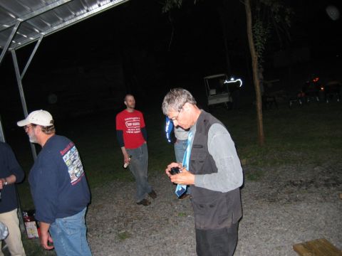 1985 Ford LTD Crown Victoria - A golf cart is visible in the background at a nighttime gathering.